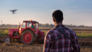 Farmer using a drone to review crops